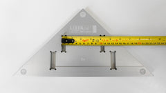 Verifying the accuracy of a tape measure at teh 10 cm push measurement using a Lixer Bench Square Multi-Instrument Calibration Tool NIST Traceable or ISO certifcation is available on Lixer Tools.