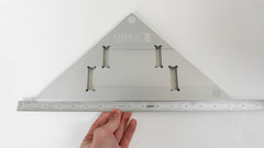 Checking a straight edge against a Lixer Bench Square Multi-Instrument Calibration Tool